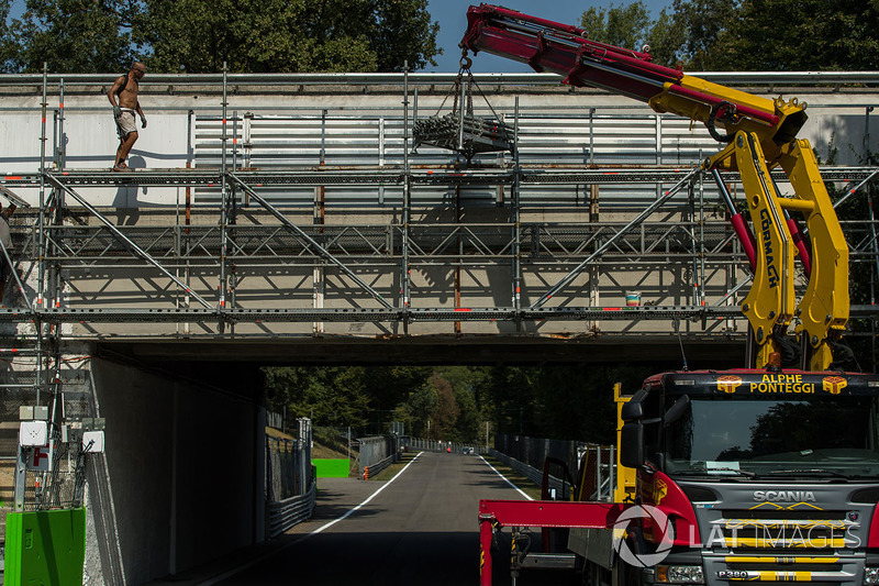 Track workers erect signage