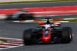 Romain Grosjean, Haas F1 Team VF-17, leads Sergio Perez, Force India VJM10