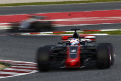 Romain Grosjean, Haas F1 Team VF-17, leads Sergio Perez, Force India VJM10