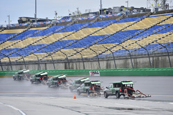 Track workers attempt to dry the track