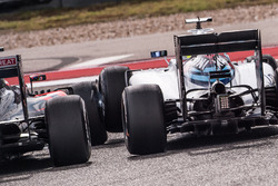Fernando Alonso, McLaren MP4-31 and Felipe Massa, Williams FW38 touch wheels