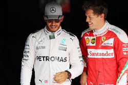 (L to R): Pole sitter Lewis Hamilton, Mercedes AMG F1 with third placed Sebastian Vettel, Ferrari in parc ferme