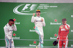 The podium (L to R): second place Lewis Hamilton, Mercedes AMG F1; Race winner Nico Rosberg, Mercede