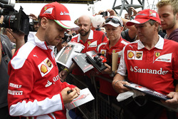 Sebastian Vettel, Ferrari signs autographs for the fans