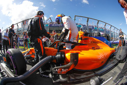 Fernando Alonso, McLaren MCL33 Renault, climbs out of his car on the grid