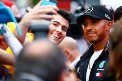 Lewis Hamilton, Mercedes AMG F1, poses for a fan to take a picture