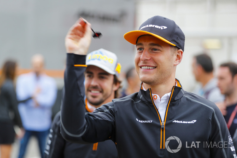 Stoffel Vandoorne, McLaren, and Fernando Alonso, McLaren, play darts