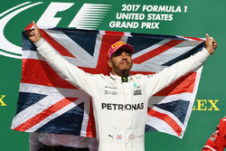 Race winner Lewis Hamilton, Mercedes AMG F1 celebrates on the podium with the Union flag