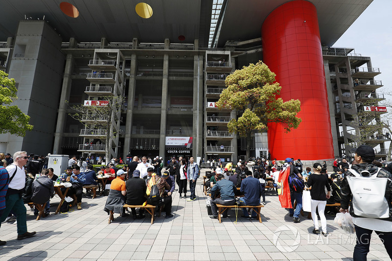 A scenic view of crowds behind a grandstand