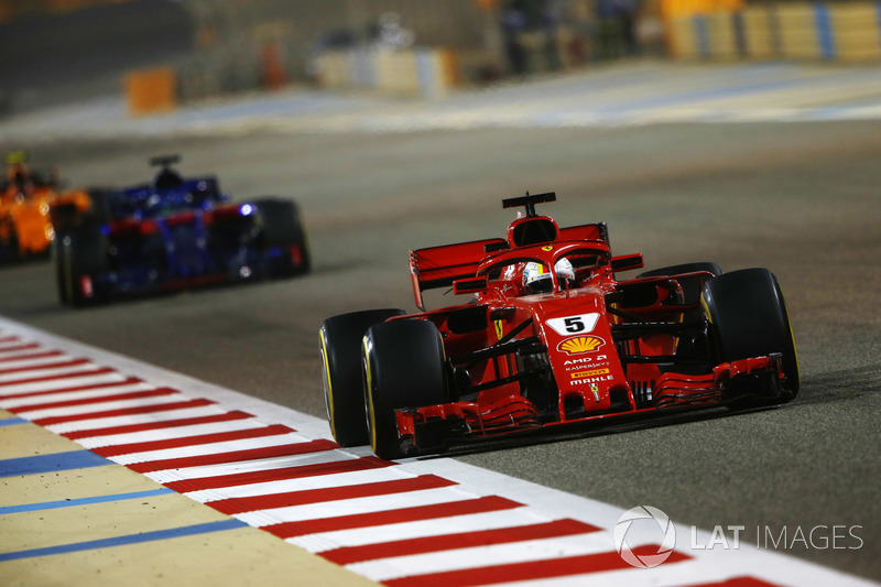 Sebastian Vettel, Ferrari SF71H, leads Brendon Hartley, Toro Rosso STR13 Honda