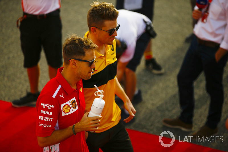 Sebastian Vettel, Ferrari, Nico Hulkenberg, Renault Sport F1 Team