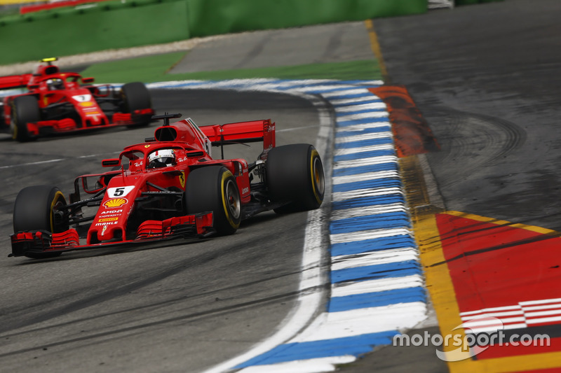 Sebastian Vettel, Ferrari SF71H, leads Kimi Raikkonen, Ferrari SF71H