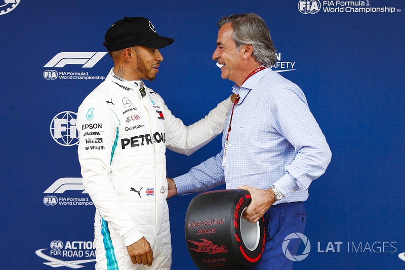 Lewis Hamilton, Mercedes AMG F1, celebrates pole position with Carlos Sainz
