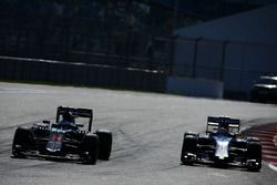 Fernando Alonso, McLaren MP4-31 and Marcus Ericsson, Sauber C35