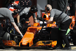 McLaren mechanics at work on the Fernando Alonso McLaren MCL32
