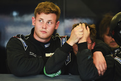 Proton Competition crew members react to their early retirement from the race