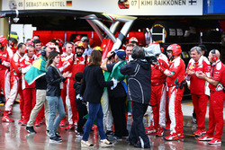 Felipe Massa, Williams is applauded by the Ferrari team and consoled by his father Luis Antonio Massa, in the pits after he retired from the race