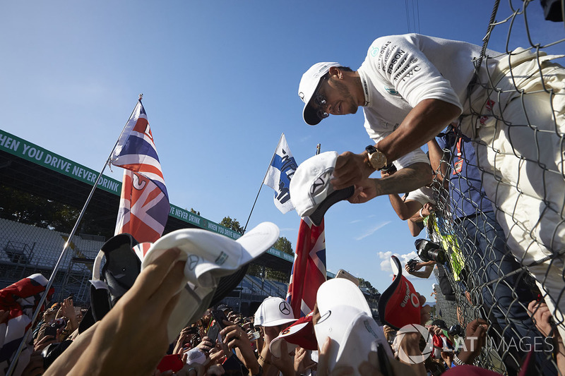 Lewis Hamilton, Mercedes AMG F1, signs autographs for fans