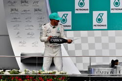 Lewis Hamilton, Mercedes AMG F1 celebrates on the podium, the champagne