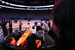 Guests take pictures of the McLaren MCL32