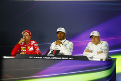 Sebastian Vettel, Ferrari, Lewis Hamilton, Mercedes AMG, and Valtteri Bottas, Mercedes AMG, in the post qualifying Press Conference