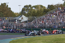 Lewis Hamilton, Mercedes AMG F1 W08, leads Sebastian Vettel, Ferrari SF70H, Valtteri Bottas, Mercedes AMG F1 W08, Kimi Raikkonen, Ferrari SF70H, Max Verstappen, Red Bull Racing RB13, and the rest of the field at the start