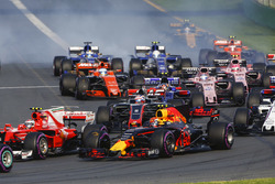 Kimi Raikkonen, Ferrari SF70H, leads Max Verstappen, Red Bull Racing RB13, Romain Grosjean, Haas F1