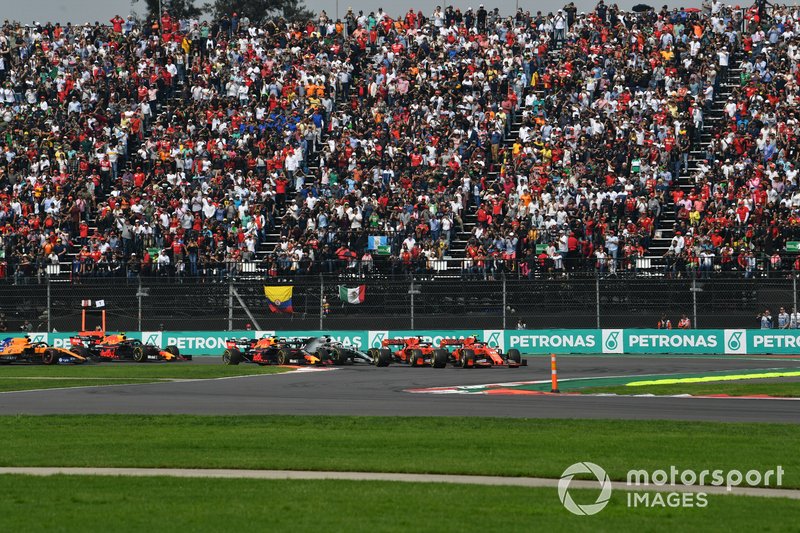 Charles Leclerc, Ferrari SF90, leads Sebastian Vettel, Ferrari SF90, Alexander Albon, Red Bull RB15, Lewis Hamilton, Mercedes AMG F1 W10, Max Verstappen, Red Bull Racing RB15, and the rest of the field at the start