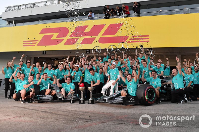 The Mercedes team celebrates after clinching their record 6th consecutive Constructors title