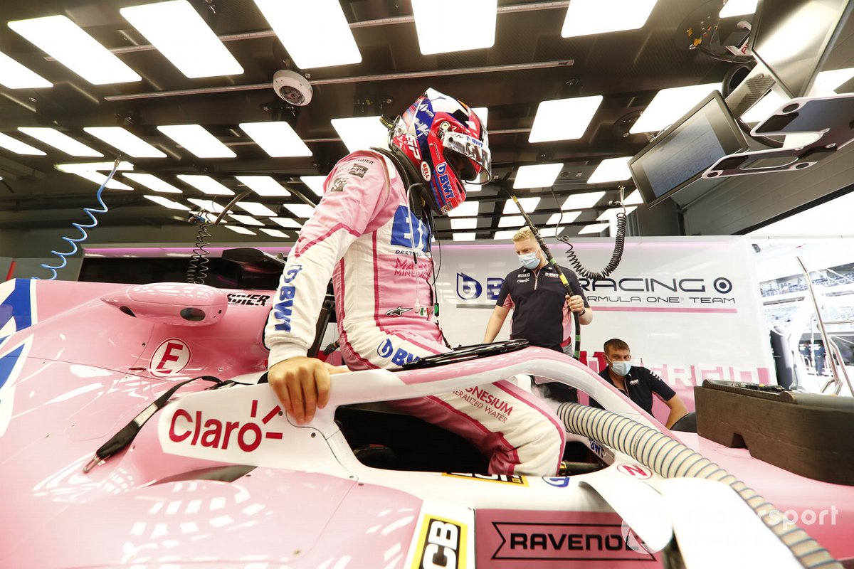 Sergio Perez, Racing Point, lowers himself into his cockpit