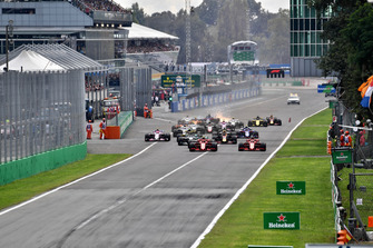 Sebastian Vettel, Ferrari SF71H and Kimi Raikkonen, Ferrari SF71H lead at the start of the race