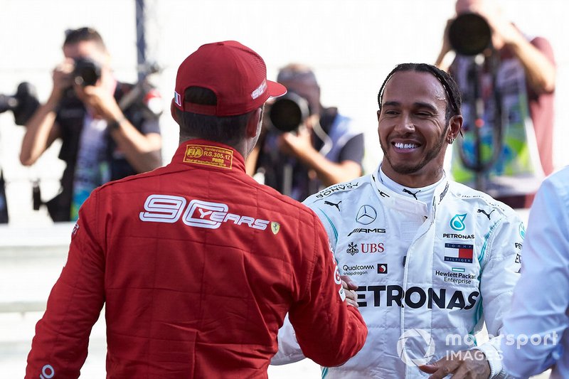 Lewis Hamilton, Mercedes AMG F1, congratulates Charles Leclerc, Ferrari, on pole