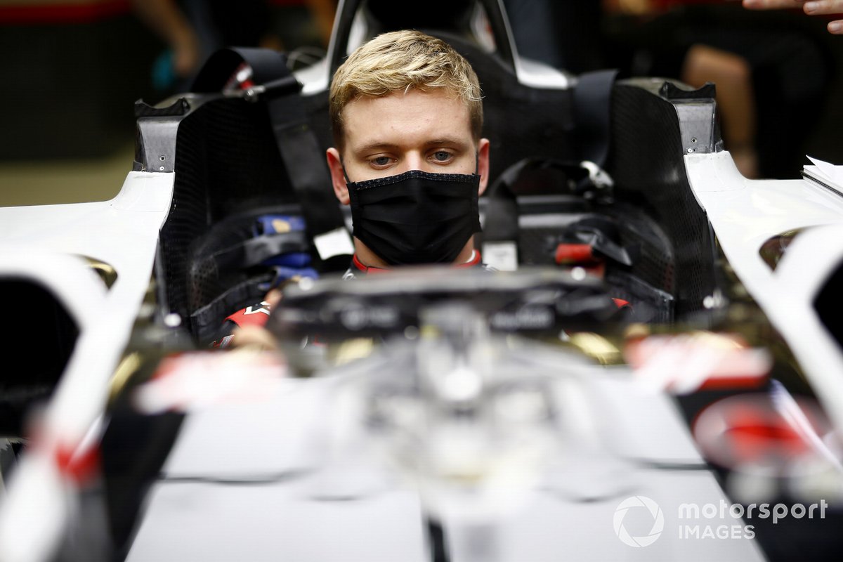 Mick Schumacher sits in his Haas VF-20 for his seat fitting.