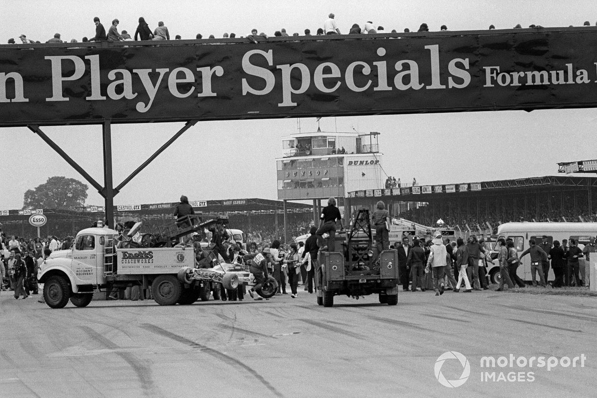 The clear up of the carnage on the main straight