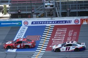 Kevin Harvick, Stewart-Haas Racing, Ford Mustang takes the checkered flag ahead of Denny Hamlin, Joe Gibbs Racing, Toyota Camry