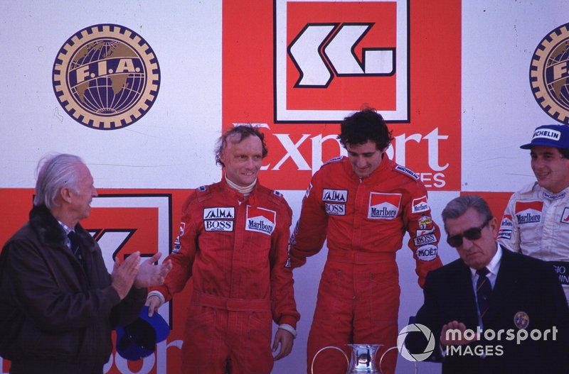 Podium: race winner Alain Prost, second place Niki Lauda, third place Ayrton Senna and Jean-Marie Balestre