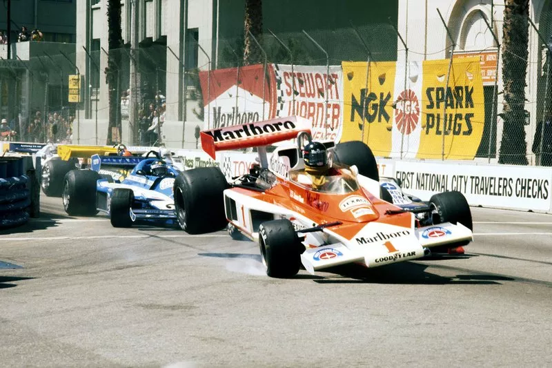 James Hunt, McLaren M23 flies into the air as he collides with John Watson, Brabham BT45B at the start of the race
