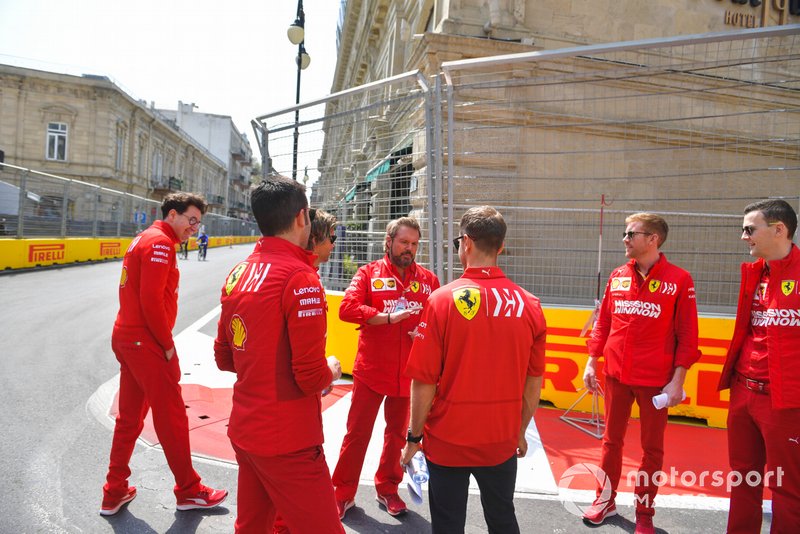 Sebastian Vettel, Ferrari walks the track with his engineers