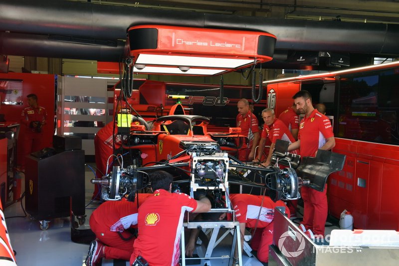 The Ferrari mechanics build the car for Charles Leclerc, Ferrari SF90, in the garage