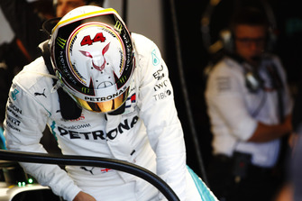 Lewis Hamilton, Mercedes AMG F1 W09 EQ Power+, climbs into his car as Peter Bonnington, Race Engineer, Mercedes AMG, looks on in the garage