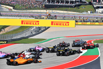 Sebastian Vettel, Ferrari SF71H runs wide at the start of the race