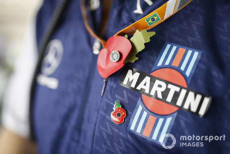 A poppy is worn on the shirt of a Williams team member