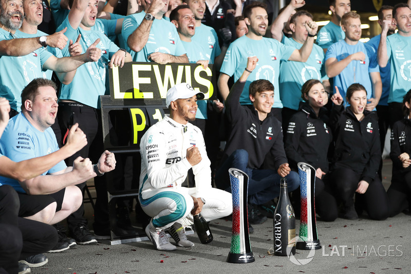 Lewis Hamilton, Mercedes AMG F1, and George Russell celebrate with the team after the race