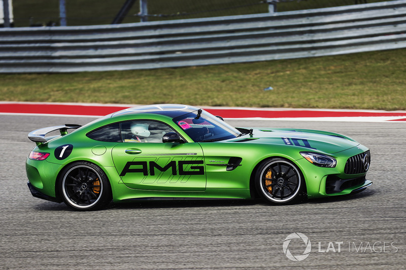 Lewis Hamilton, Mercedes AMG F1, drives a Mercedes SLS around the track with Usain Bolt in the passenger seat