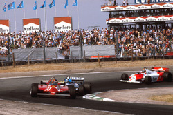 Gilles Villeneuve, Ferrari 126CK followed by Jacques Laffite, Ligier JS17 Matra and John Watson, McLaren MP4/1 Ford.
