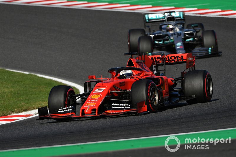 Sebastian Vettel, Ferrari SF90, leads Lewis Hamilton, Mercedes AMG F1 W10