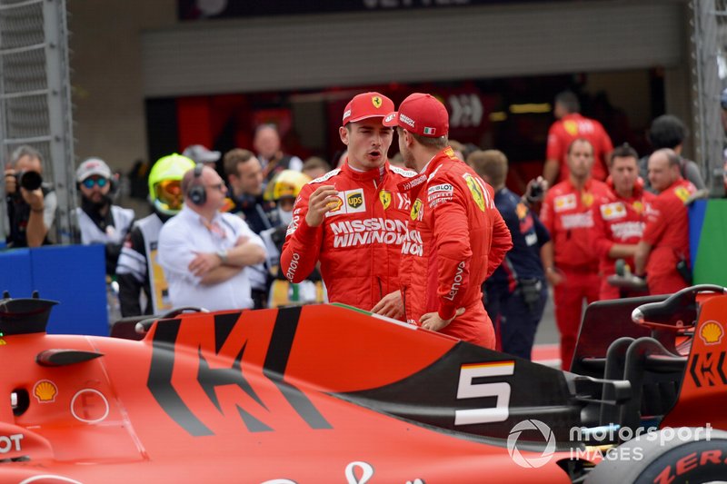 Charles Leclerc, Ferrari, and Sebastian Vettel, Ferrari, talk after Qualifying