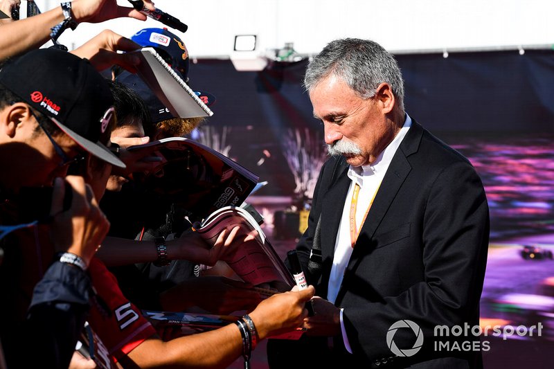 Chase Carey, Chairman, Formula 1 signs an autograph for a fan