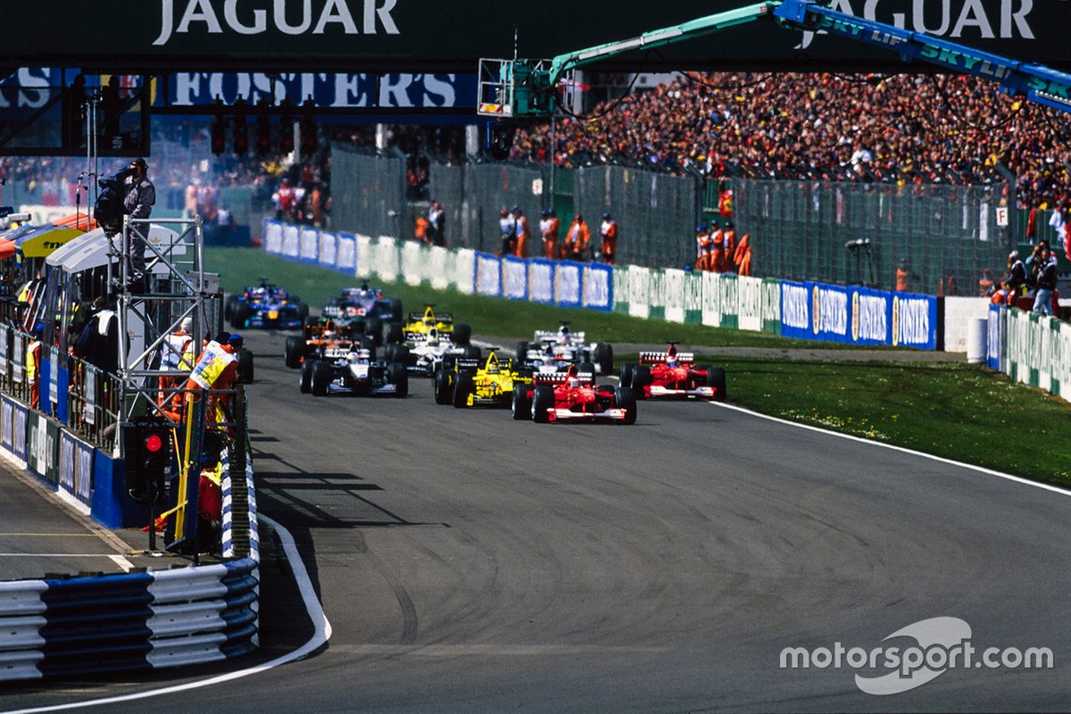 Michael Schumacher, Ferrari F1-2000, Rubens Barrichello, Ferrari F1-2000 in testa alla partenza della gara, GP della Gran Bretagna del 2000