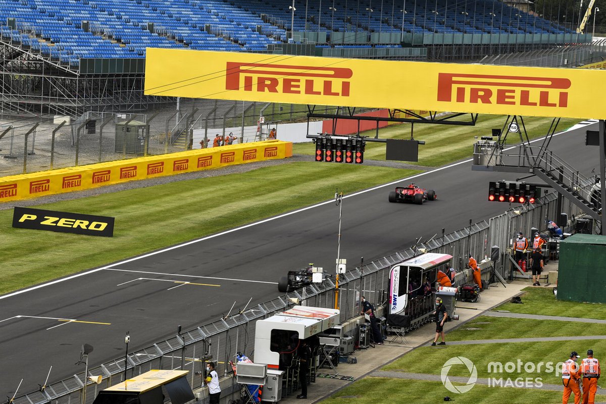 Sebastian Vettel, Ferrari SF1000, and Valtteri Bottas, Mercedes F1 W11, practice their start procedures